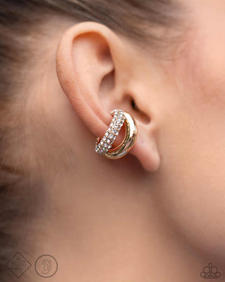 Sizzling Spotlight - Gold - White Rhinestone Encrusted Paparazzi Ear Cuff Earrings - April 2024 Magnificent Musings