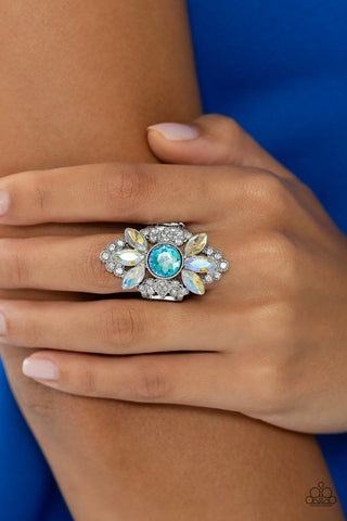 GLISTEN Here! - Blue - and Iridescent Rhinestone Paparazzi Ring - July 2023 Life of the Party Exclusive