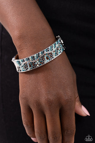 Wavy Whimsy - Blue - and Iridescent Rhinestone Paparazzi Hinge Bracelet
